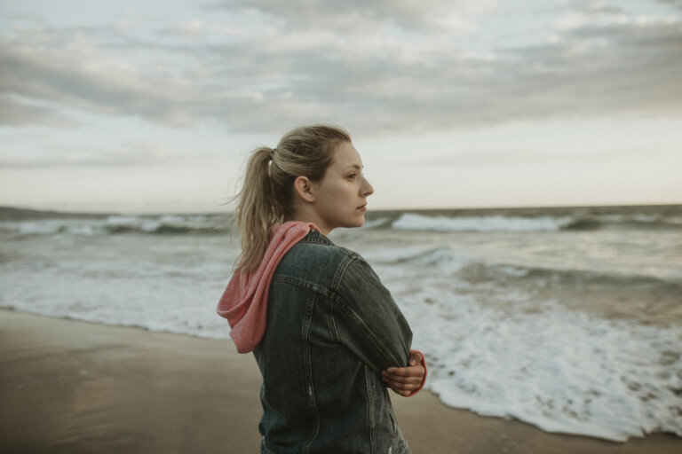 Woman on a gloomy beach