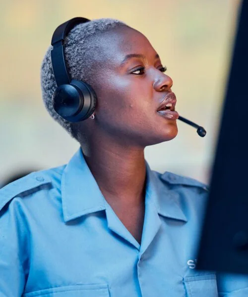 Female telecommunications agent at a desk